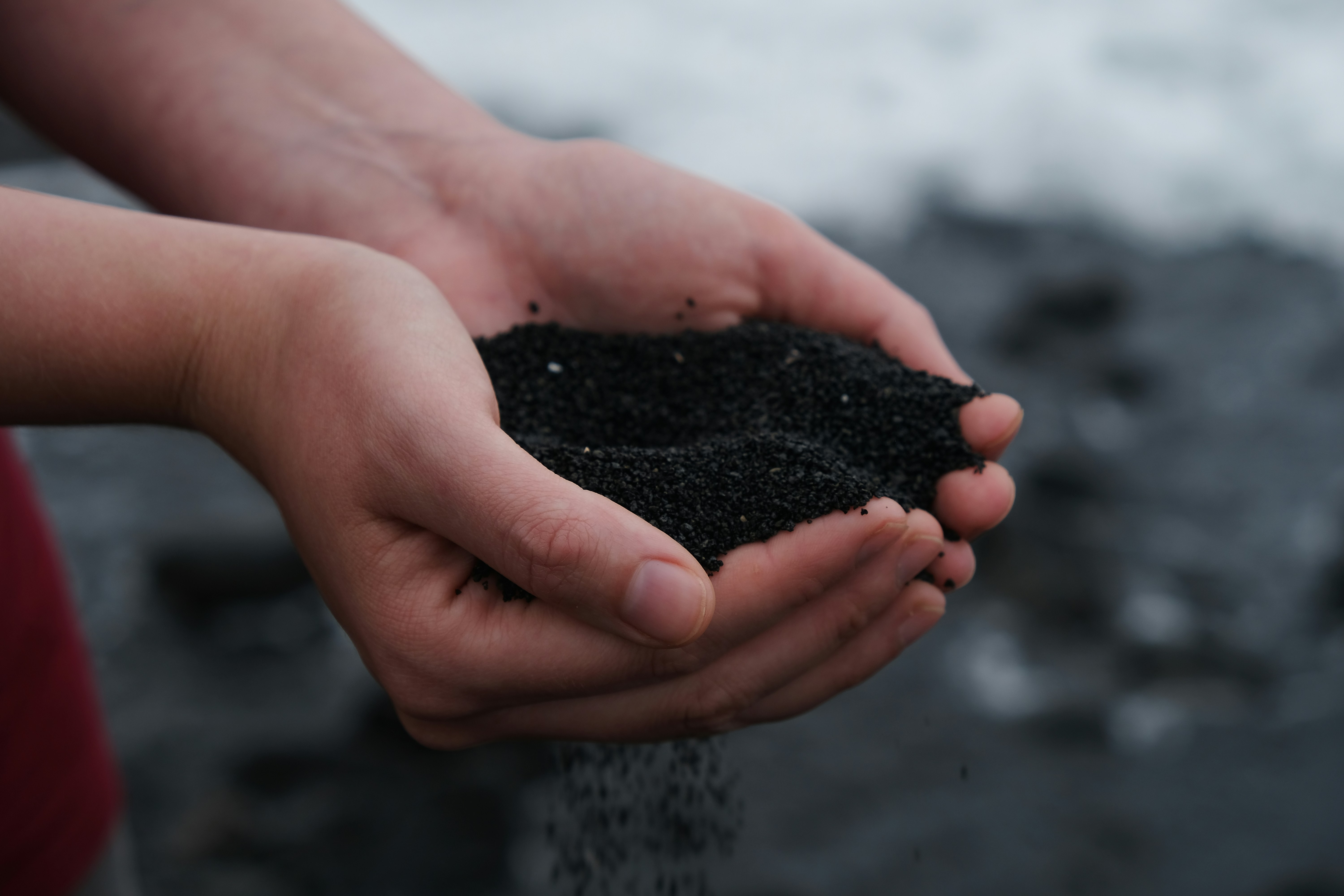 Hands holding soil